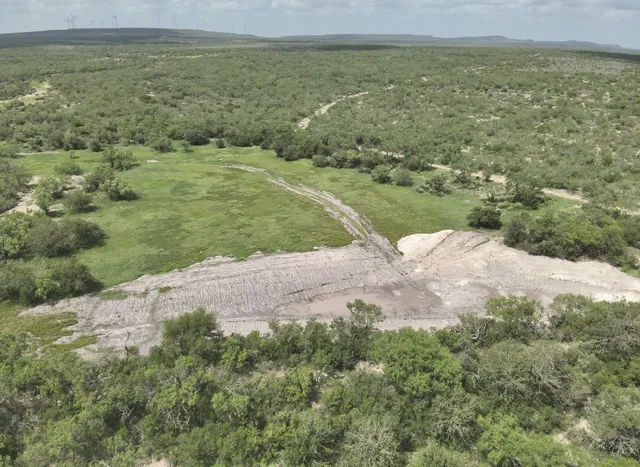 a view of a lake with a yard