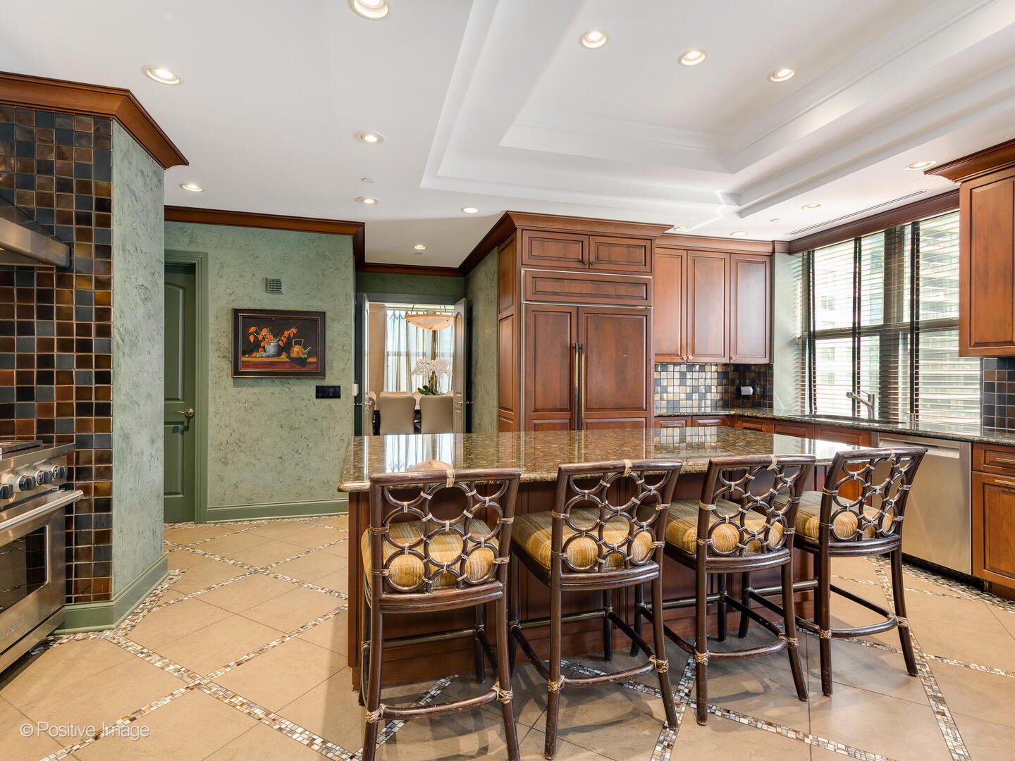 55 West Delaware Place, Unit 1101 Chicago, IL 60610 - Photo 20 of 41 a dining hall with stainless steel appliances a dining table and chairs