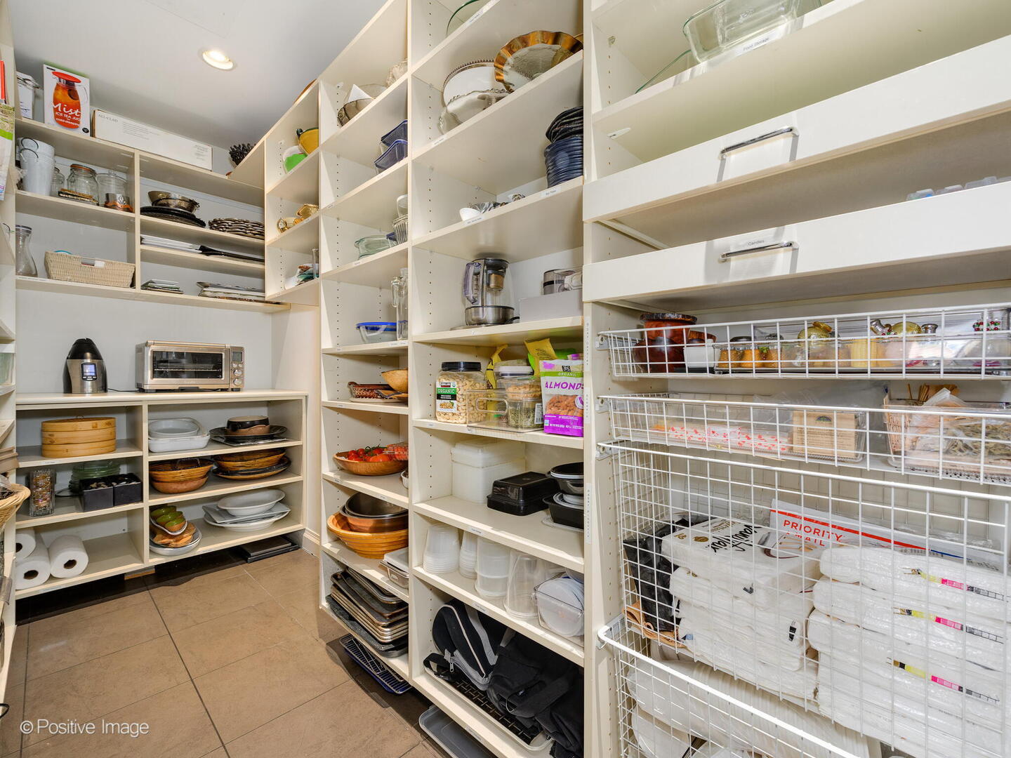 55 West Delaware Place, Unit 1101 Chicago, IL 60610 - Photo 24 of 41 a kitchen with refrigerator and cabinets