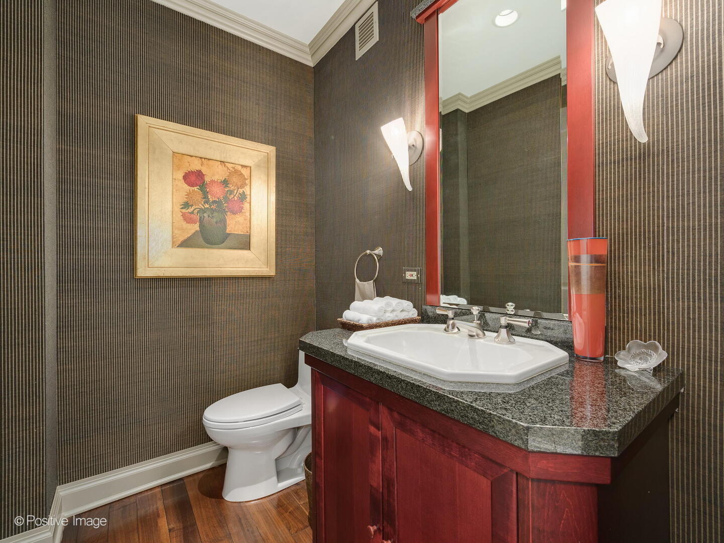 55 West Delaware Place, Unit 1101 Chicago, IL 60610 - Photo 25 of 41 a bathroom with a granite countertop toilet sink and mirror
