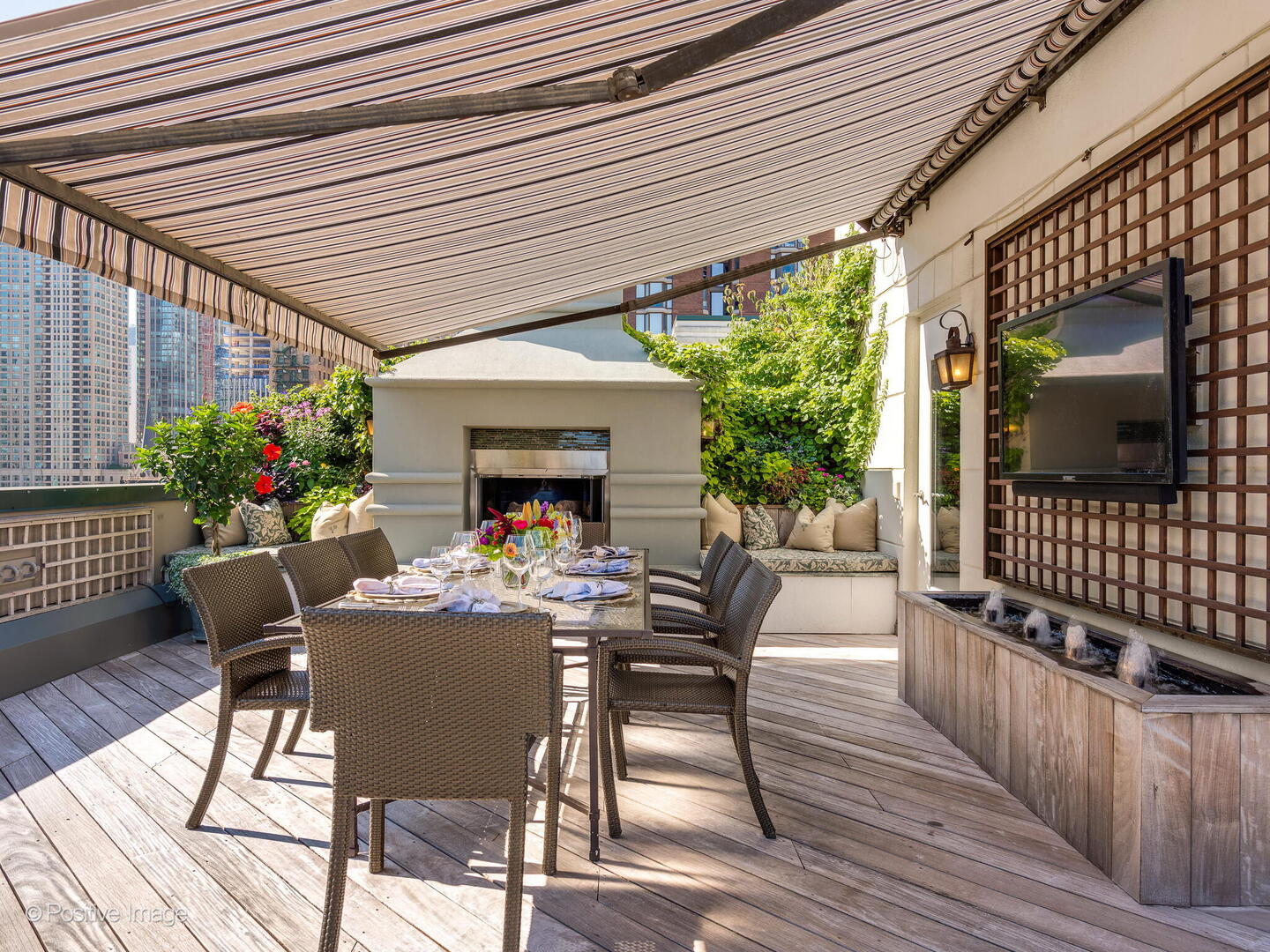 55 West Delaware Place, Unit 1101 Chicago, IL 60610 - Photo 3 of 41 a view of a patio with a table and chairs and potted plants