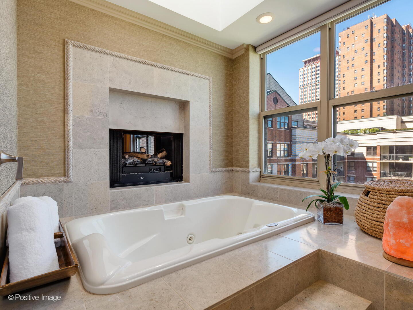 55 West Delaware Place, Unit 1101 Chicago, IL 60610 - Photo 32 of 41 a bathroom with a tub a sink and a window