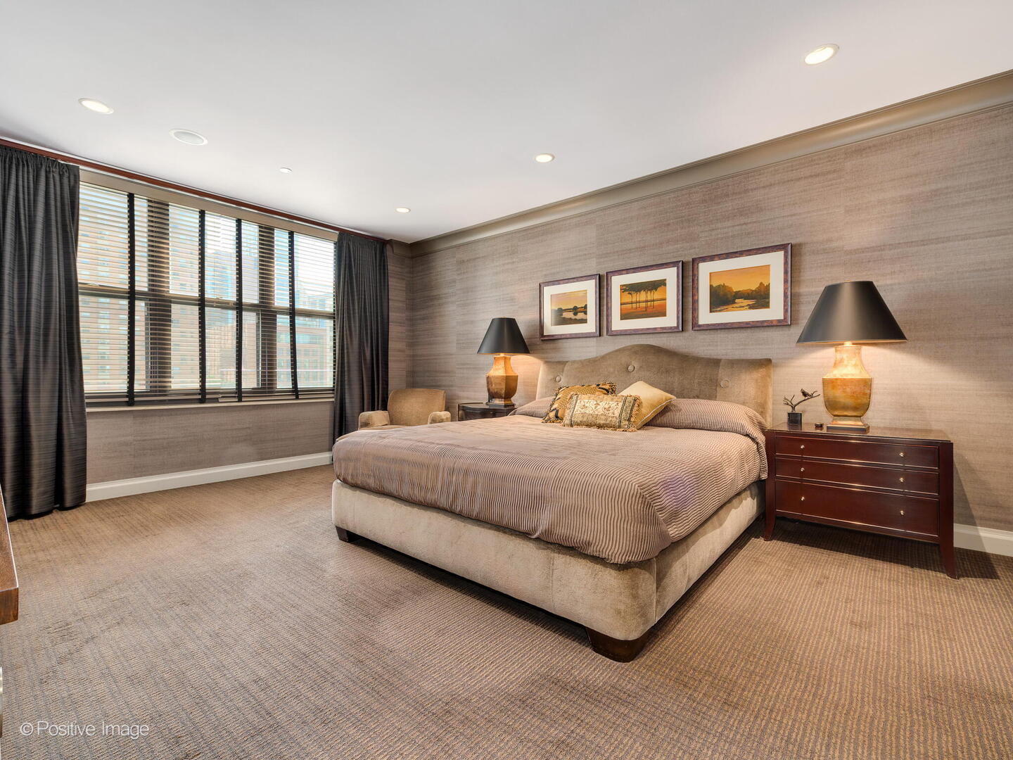 55 West Delaware Place, Unit 1101 Chicago, IL 60610 - Photo 39 of 41 a bedroom with a large bed and a large window