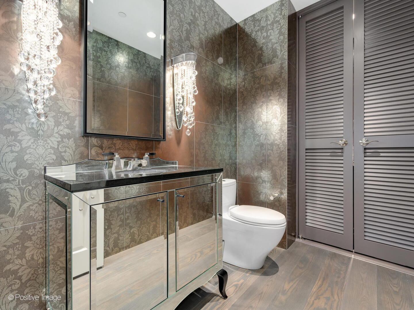 55 West Delaware Place, Unit 1101 Chicago, IL 60610 - Photo 40 of 41 a bathroom with a sink toilet and mirror