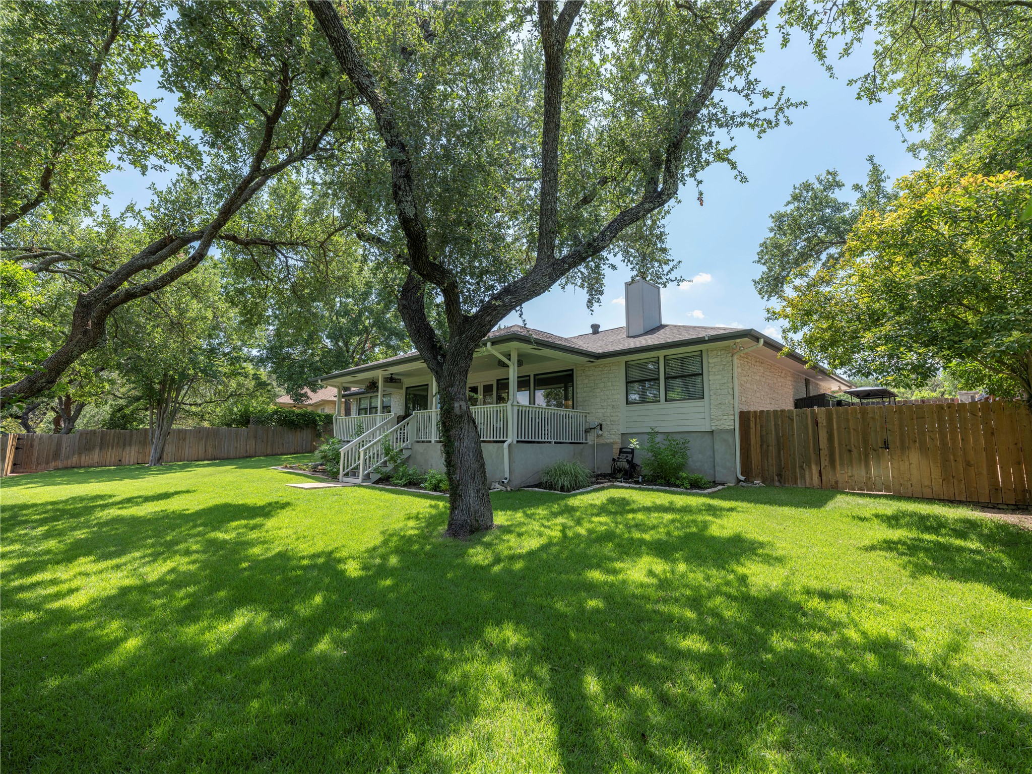 121 Copperleaf Road Lakeway, TX 78734 - Photo 1 of 1 Zoyzia lawn shaded by live oaks