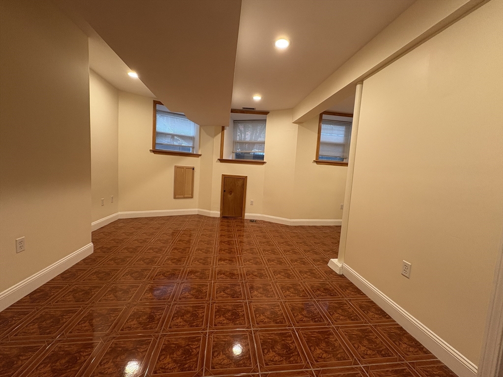 191 Winthrop Road, Unit 1 Brookline, MA 02445 - Photo 12 of 15 a view of a hallway with wooden floor