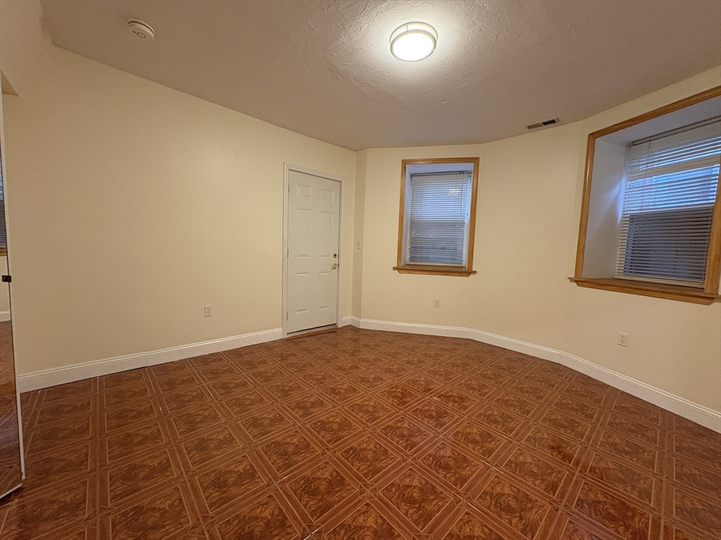 191 Winthrop Road, Unit 1 Brookline, MA 02445 - Photo 14 of 15 an empty room with a workbench