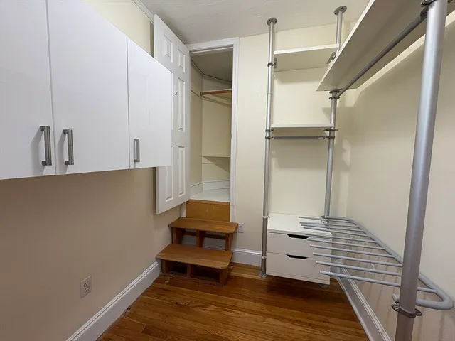 a view of kitchen with furniture and wooden floor