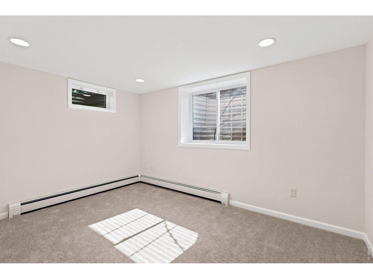2121 18th Street Road Greeley, CO 80631 - Photo 20 of 40 The forth bedroom is secluded with an egress window.