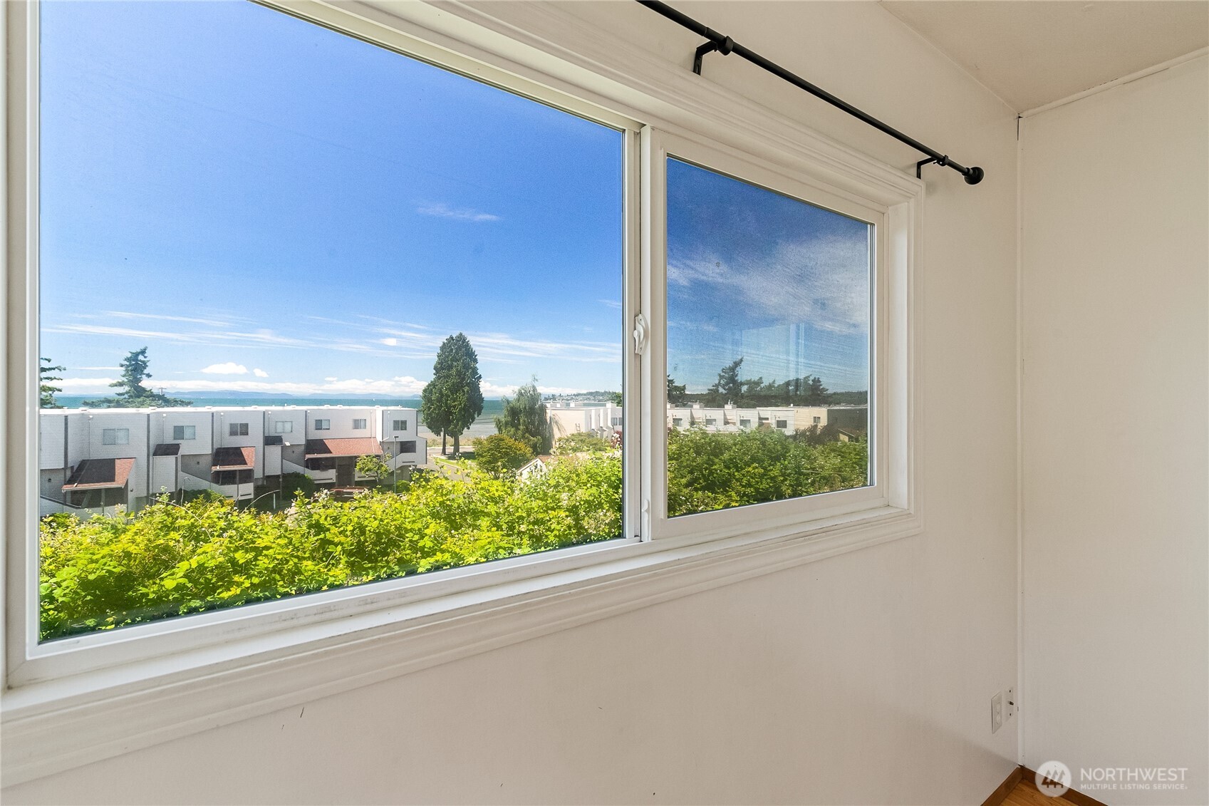 8080 Harborview Road, Unit 167 Blaine, WA 98230 - Photo 11 of 27 a view of a glass door with a balcony from a window