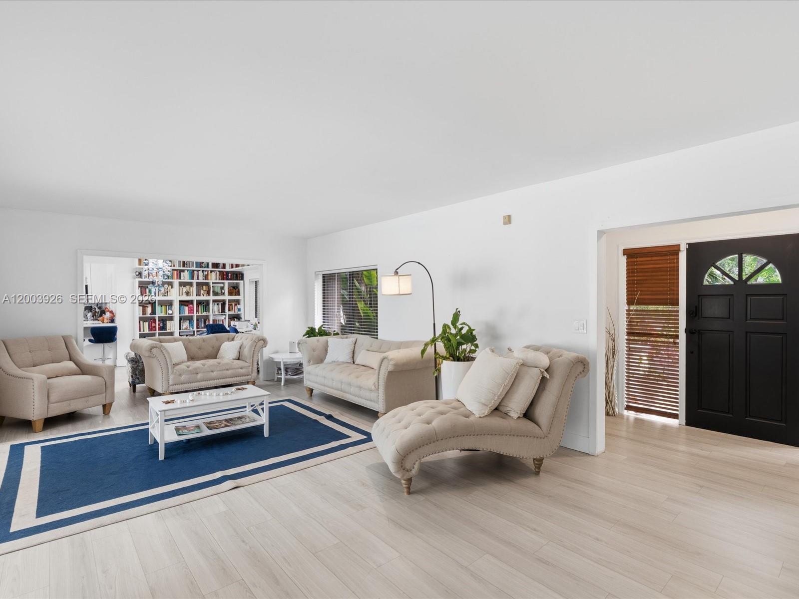 5000 Riviera Drive Coral Gables, FL 33146 - Photo 11 of 80 a living room with furniture and a wooden floor