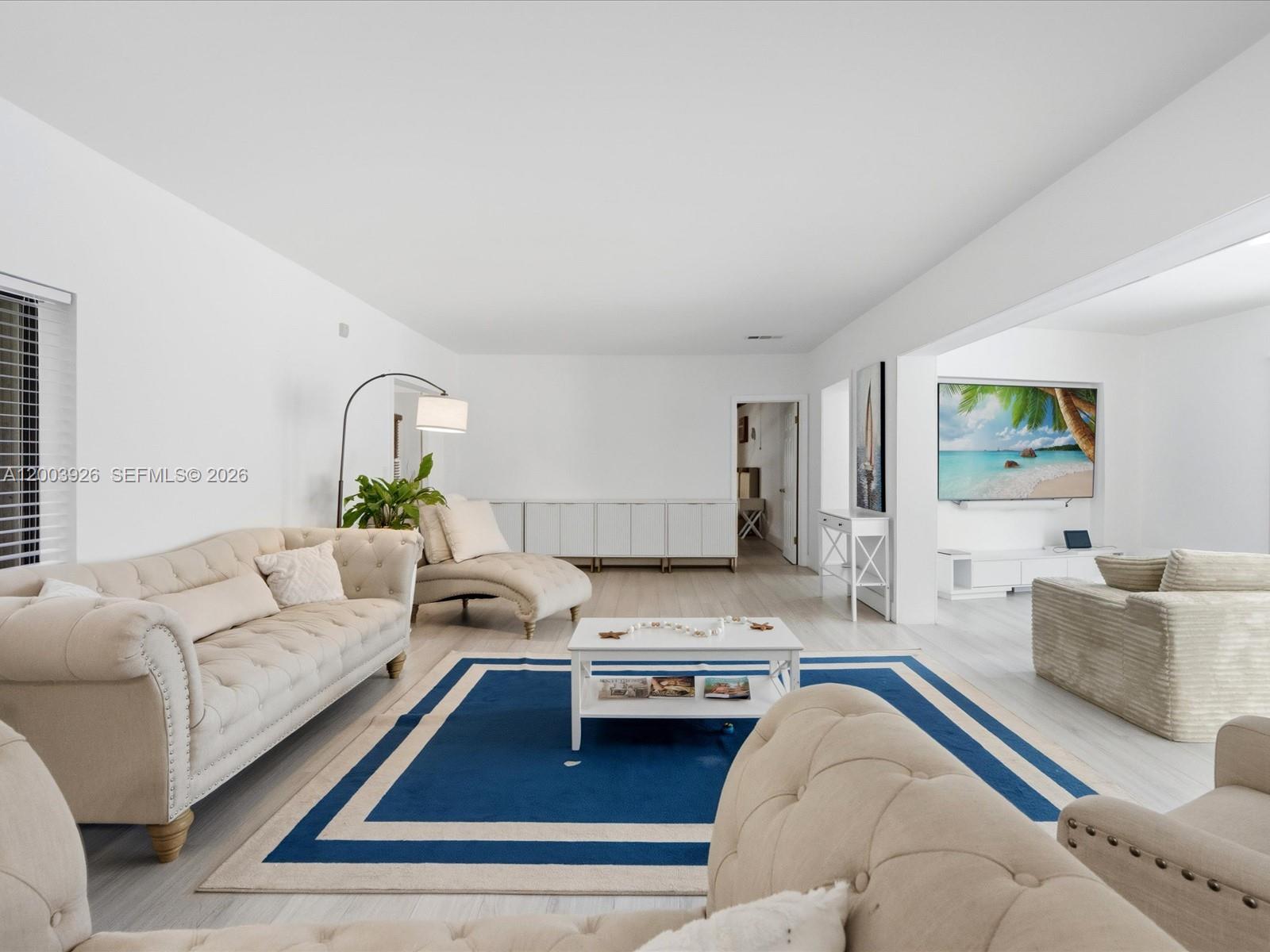5000 Riviera Drive Coral Gables, FL 33146 - Photo 12 of 80 a living room with furniture and a couch