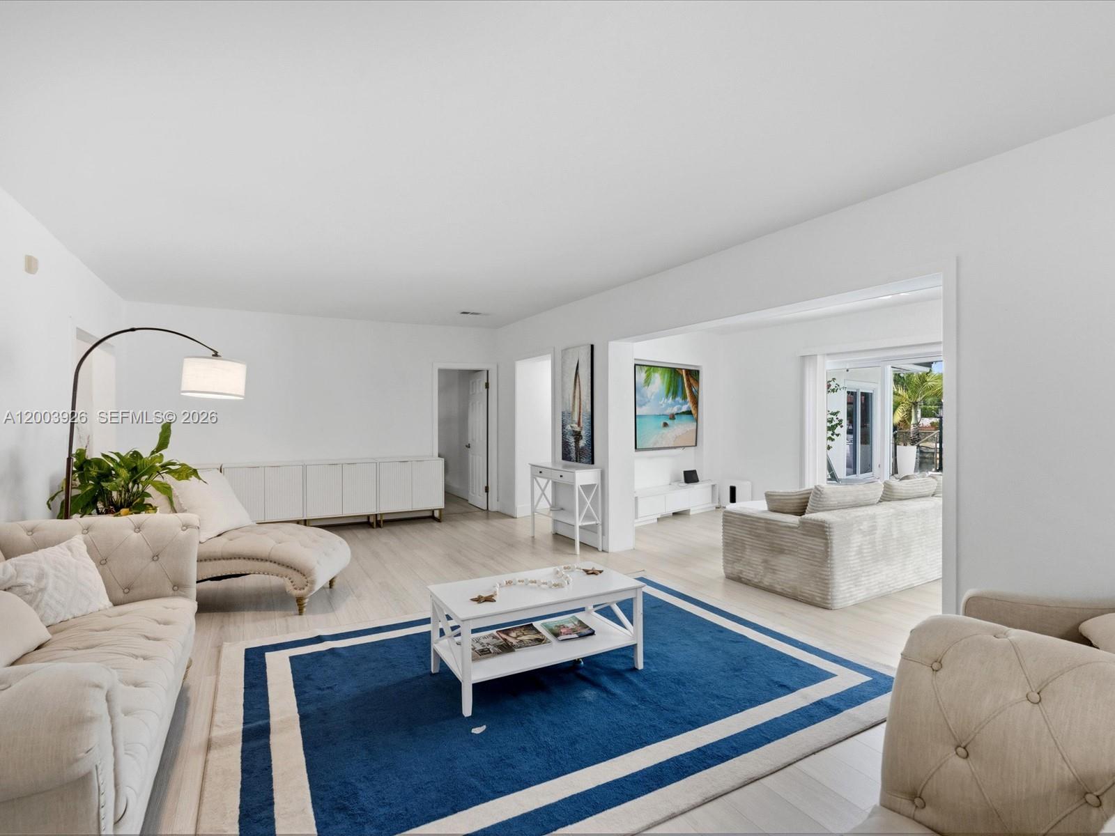 5000 Riviera Drive Coral Gables, FL 33146 - Photo 13 of 80 a living room with furniture and wooden floor