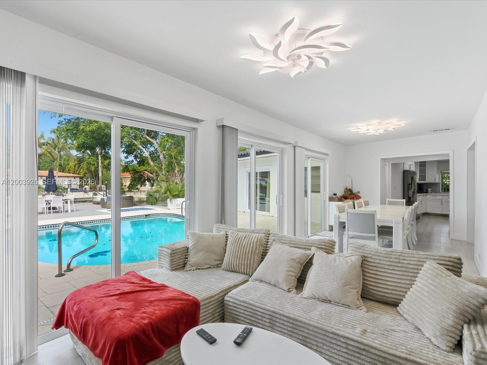 5000 Riviera Drive Coral Gables, FL 33146 - Photo 16 of 80 a living room with furniture and a large window