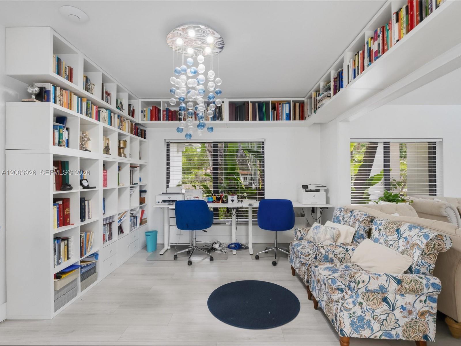5000 Riviera Drive Coral Gables, FL 33146 - Photo 26 of 80 a living room with furniture or chandelier and a rug