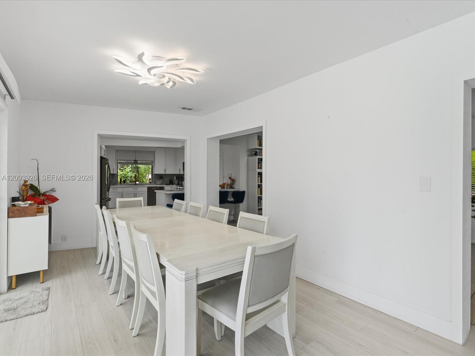 5000 Riviera Drive Coral Gables, FL 33146 - Photo 31 of 80 a view of a dining room with furniture and a livingroom