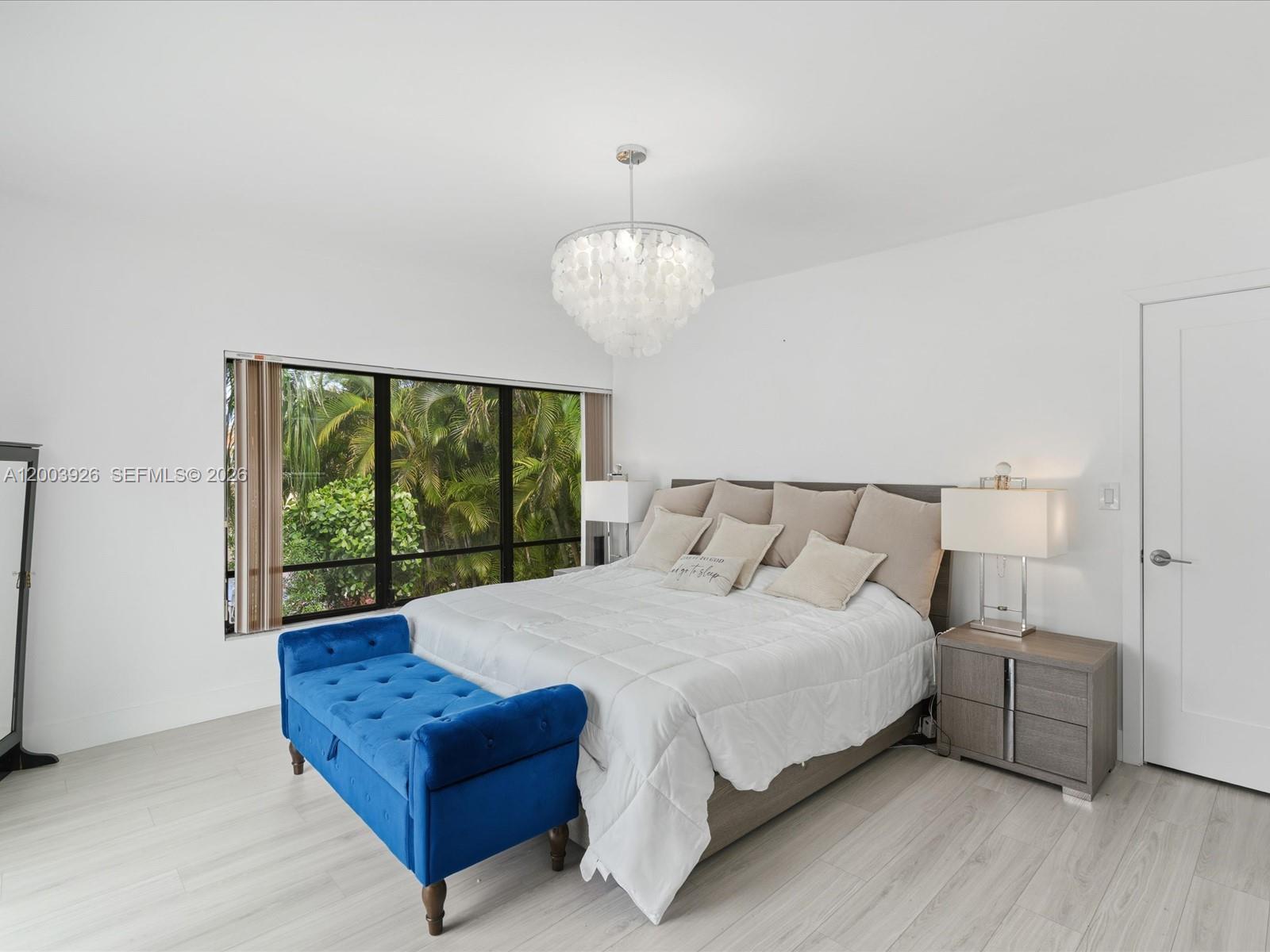 5000 Riviera Drive Coral Gables, FL 33146 - Photo 36 of 80 a bed sitting in a bedroom next to a window