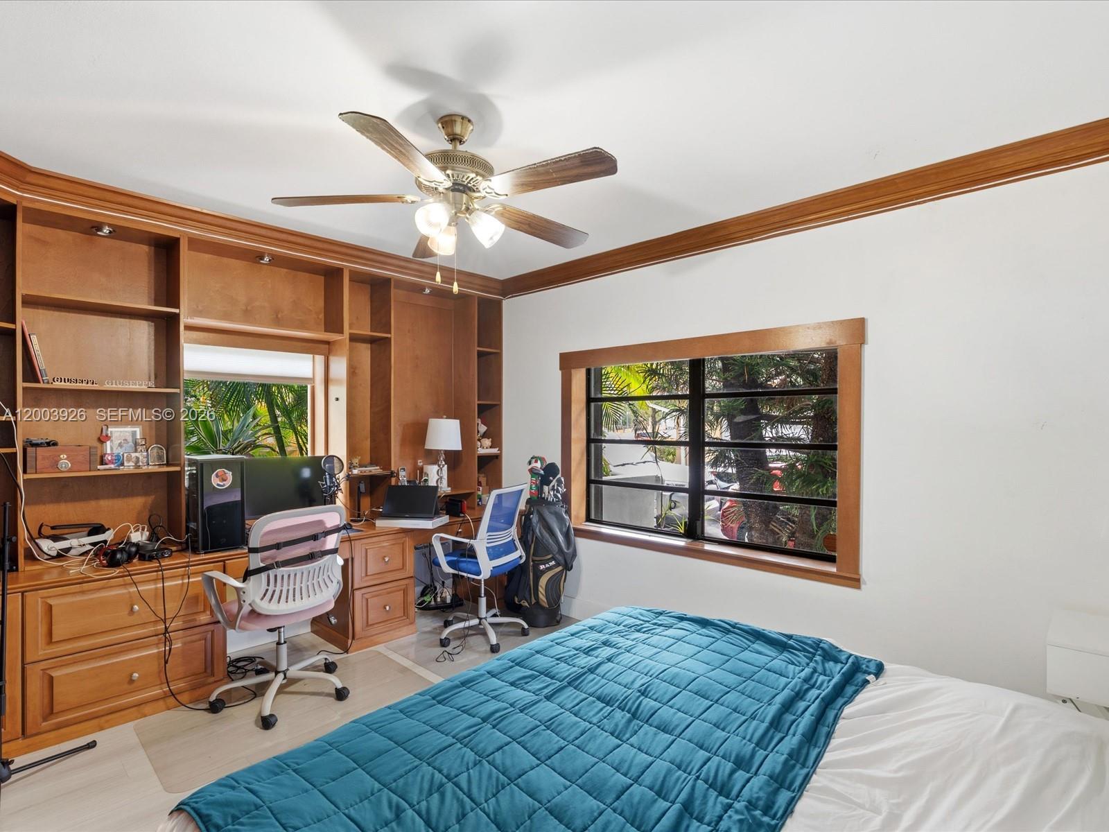 5000 Riviera Drive Coral Gables, FL 33146 - Photo 43 of 80 a living room with furniture a window and appliances
