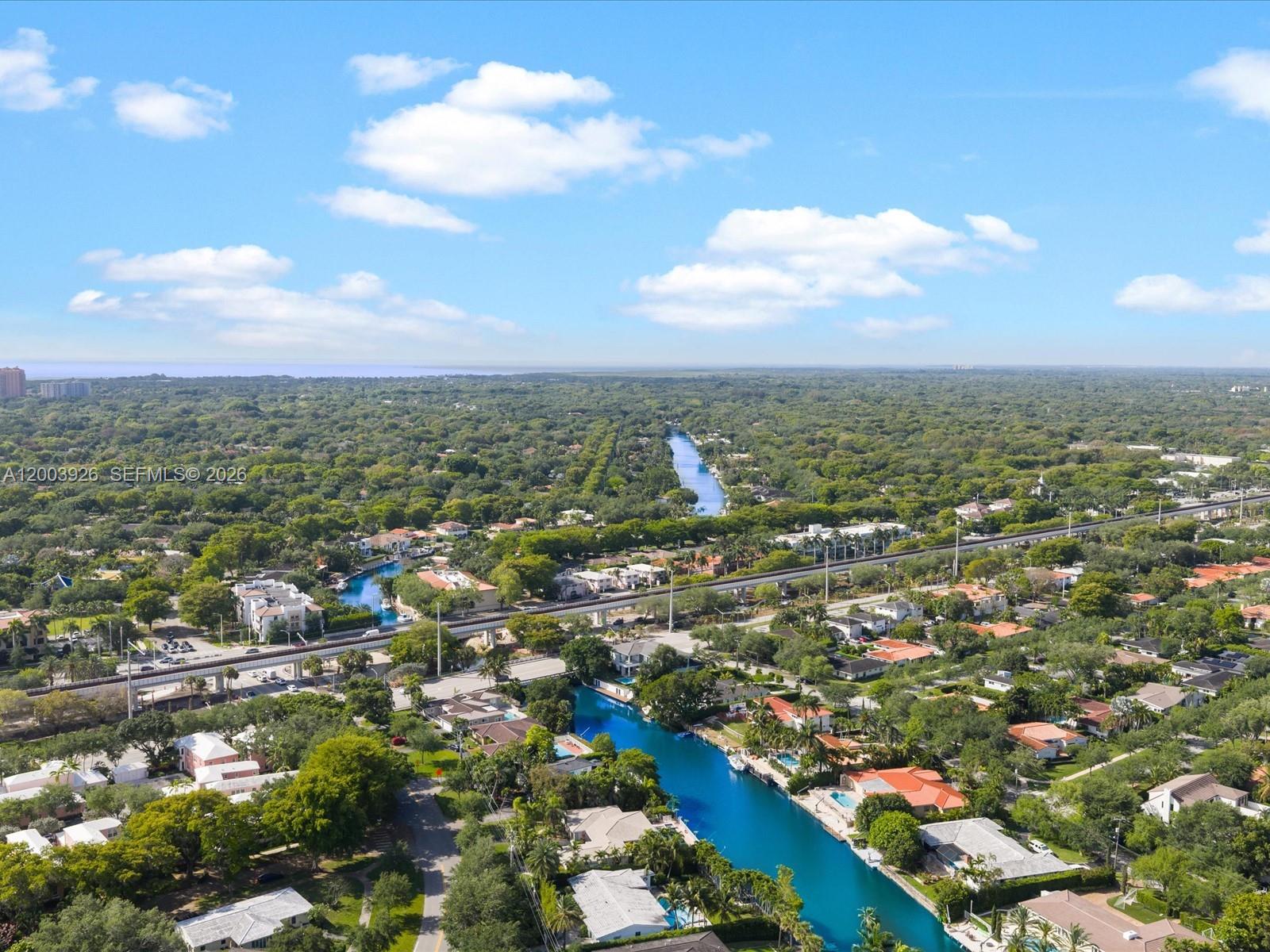 5000 Riviera Drive Coral Gables, FL 33146 - Photo 59 of 80 an aerial view of residential building with green space