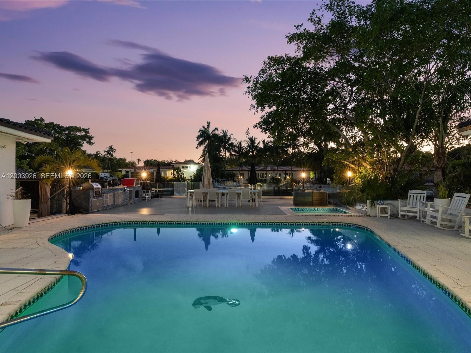 5000 Riviera Drive Coral Gables, FL 33146 - Photo 68 of 80 a swimming pool view with a seating space