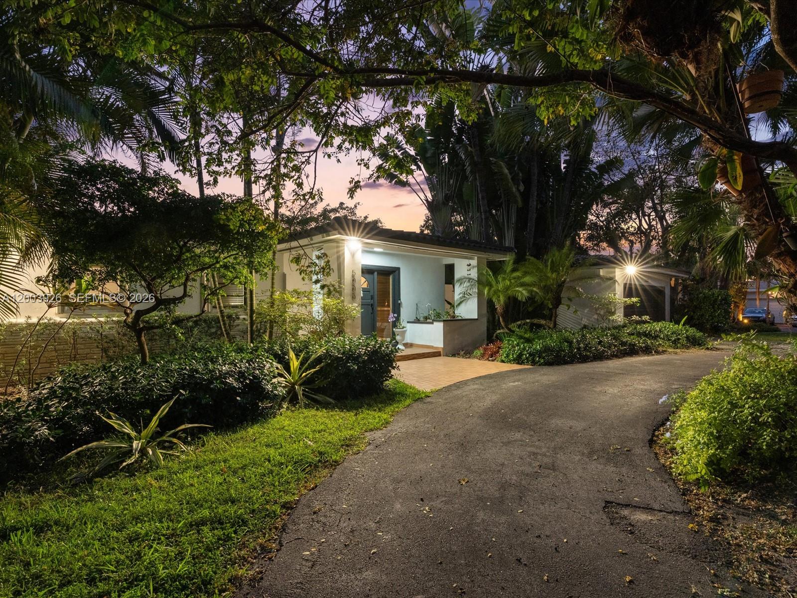 5000 Riviera Drive Coral Gables, FL 33146 - Photo 7 of 80 a view of a house with a backyard