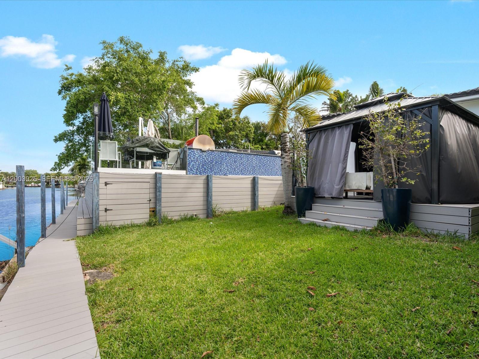 5000 Riviera Drive Coral Gables, FL 33146 - Photo 73 of 80 a view of backyard with a garden and entertaining space