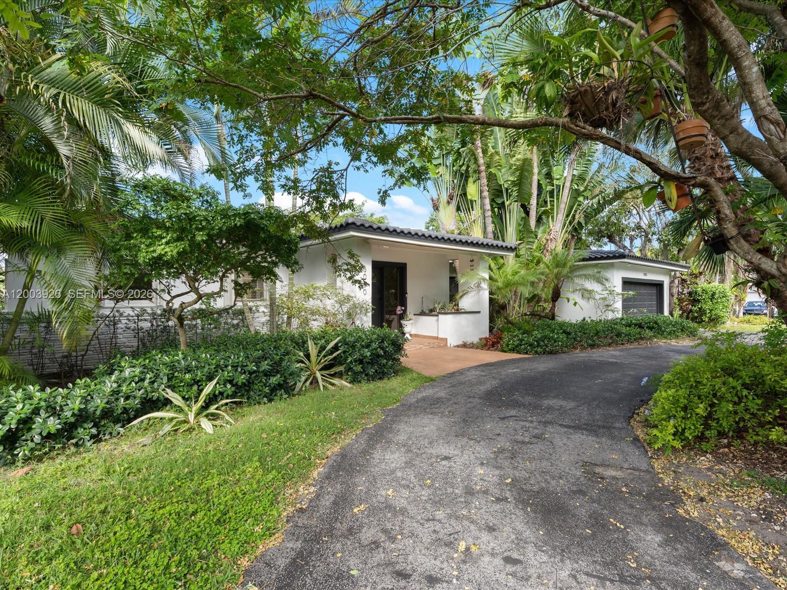 5000 Riviera Drive Coral Gables, FL 33146 - Photo 80 of 80 a view of a house with a yard