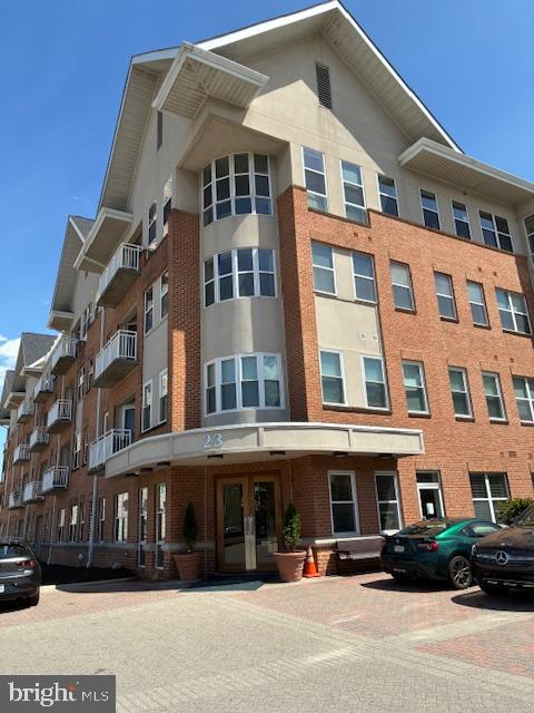 a front view of a building with a street