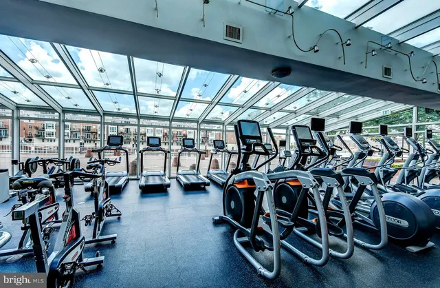 a view of a studio with wooden floor