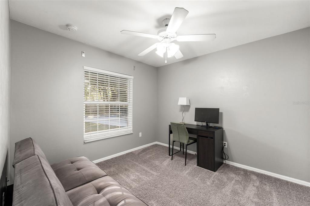 4928 Southwest 63rd Lane Gainesville, FL 32608 - Photo 19 of 32 a livingroom with workspace and a window