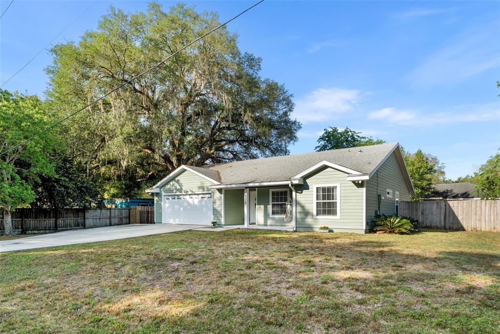 4928 Southwest 63rd Lane Gainesville, FL 32608 - Photo 2 of 32 a view of a house with a yard