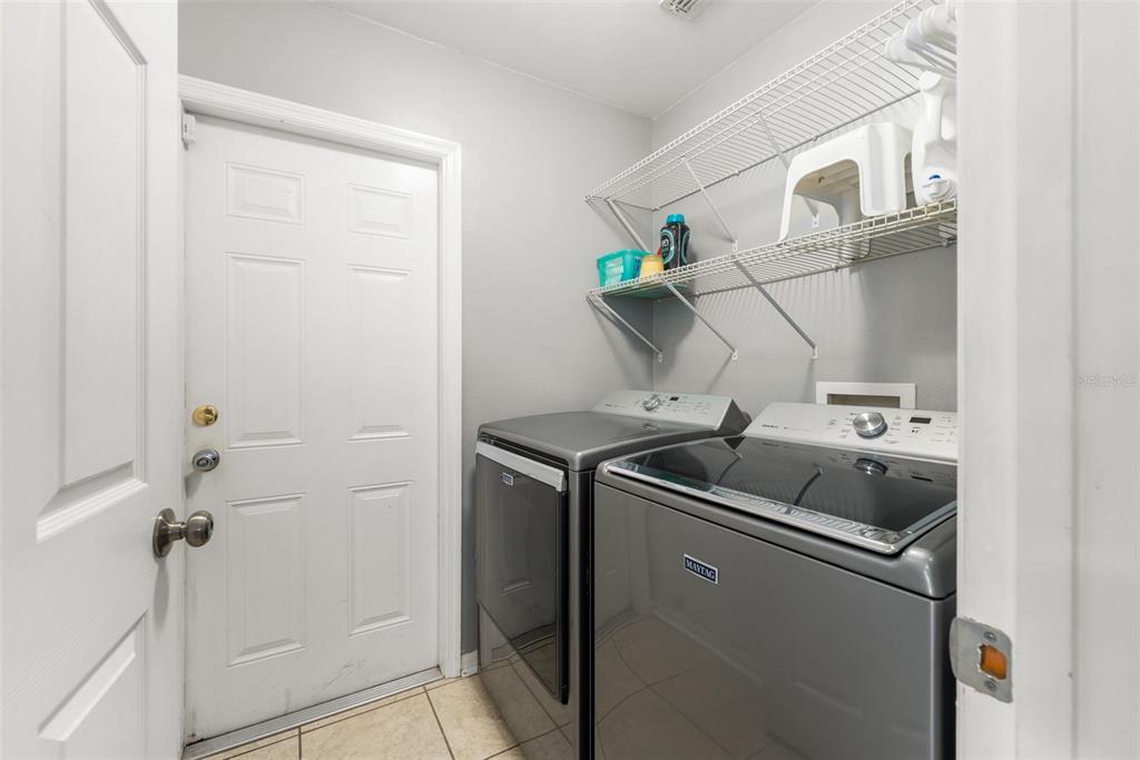4928 Southwest 63rd Lane Gainesville, FL 32608 - Photo 24 of 32 a room with storage and utility