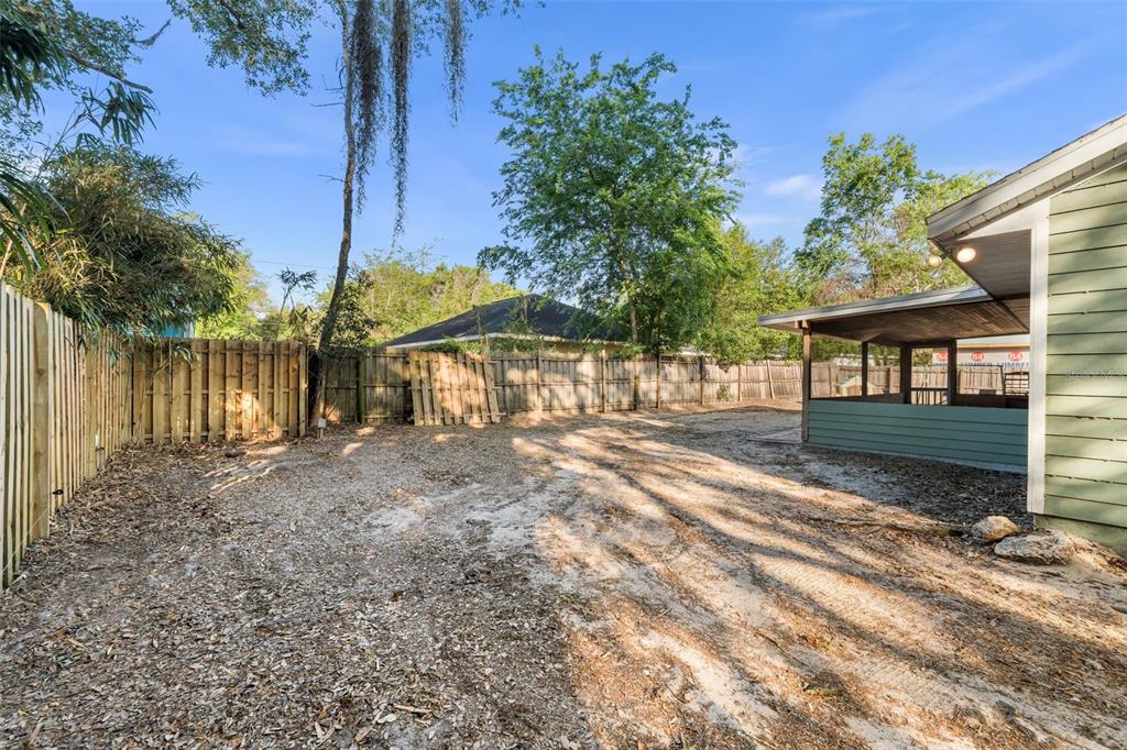4928 Southwest 63rd Lane Gainesville, FL 32608 - Photo 32 of 32 a view of a house with backyard and a area