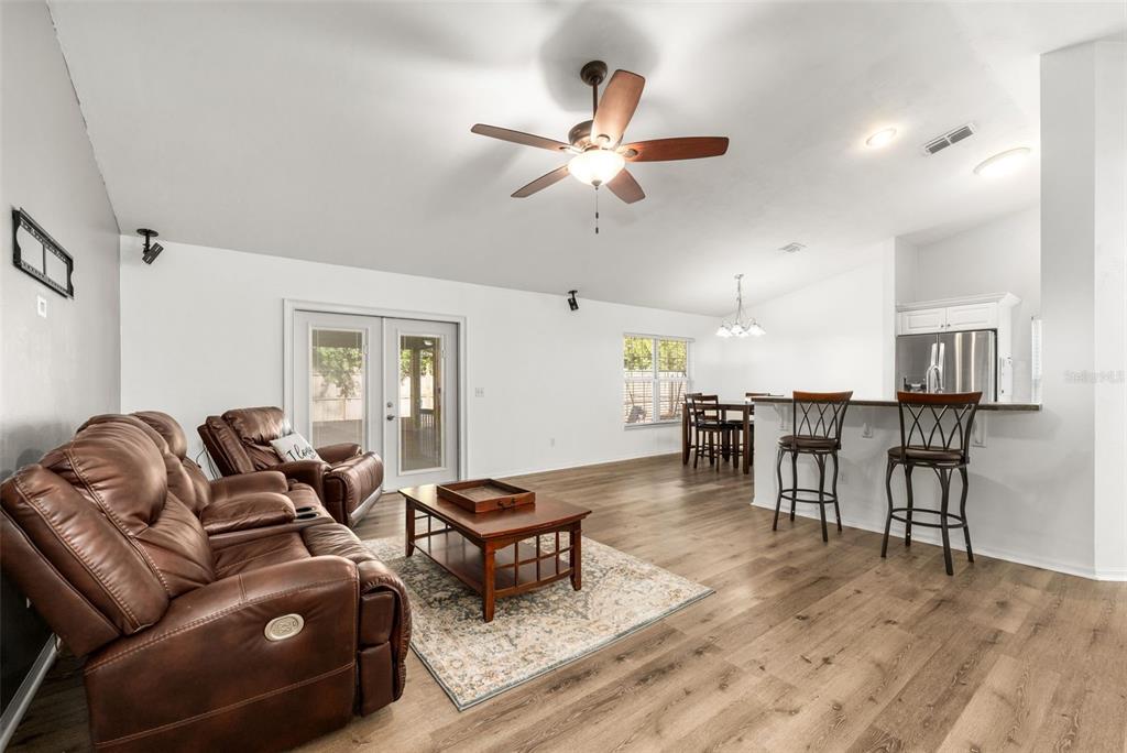 4928 Southwest 63rd Lane Gainesville, FL 32608 - Photo 5 of 32 a living room with furniture and a wooden floor