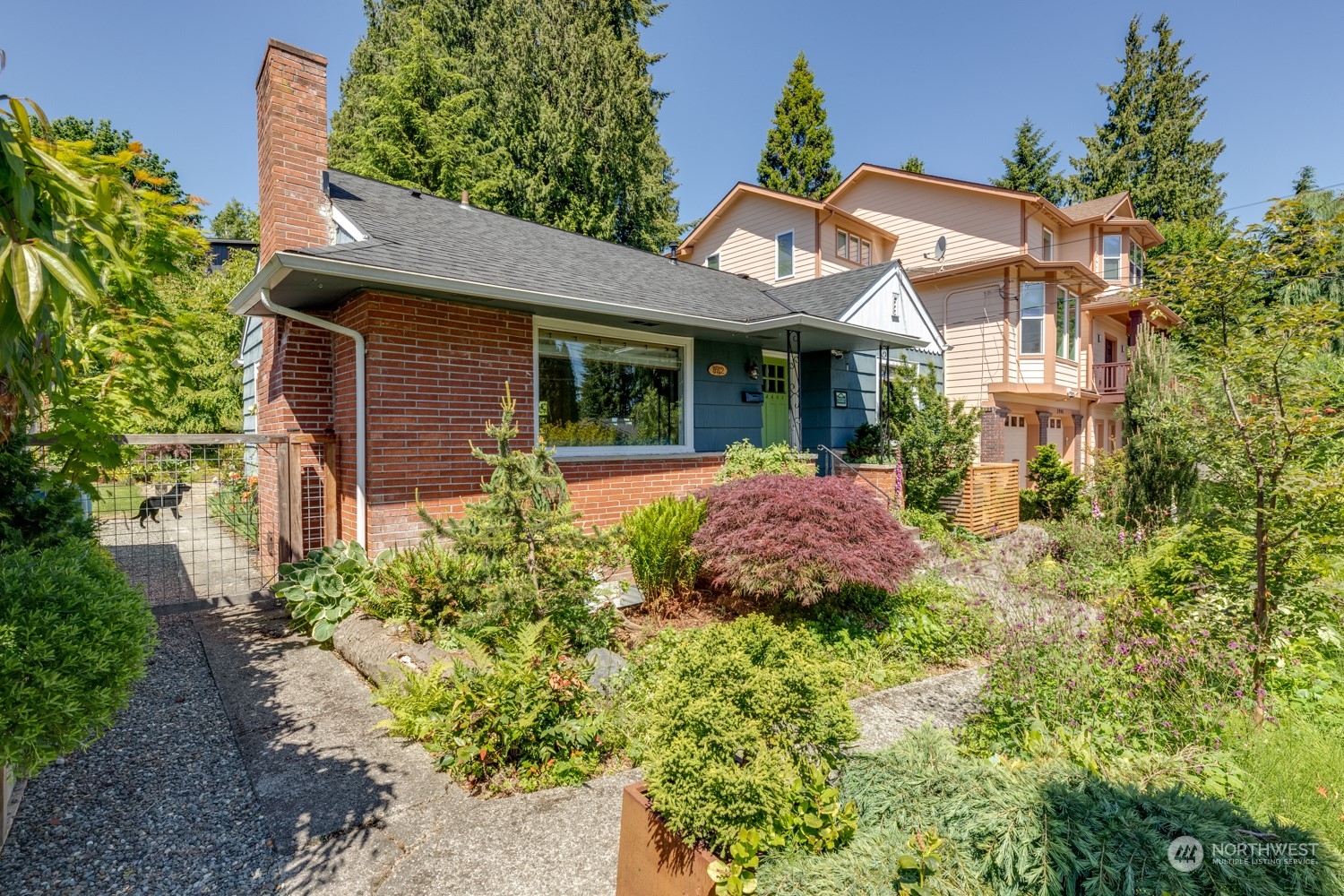 3912 Friday Avenue Everett, WA 98201 - Photo 2 of 35 a front view of a house with a yard and potted plants