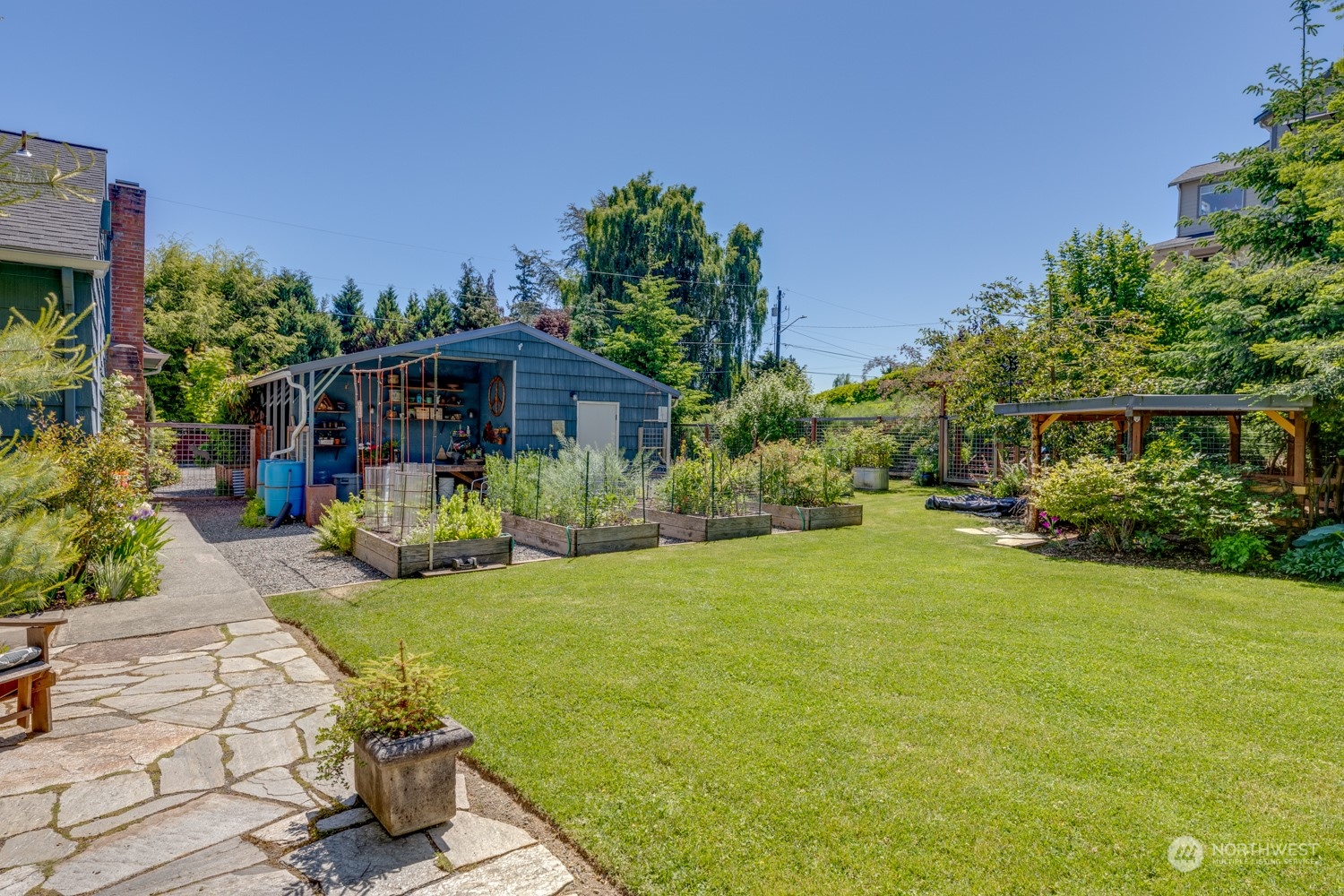 3912 Friday Avenue Everett, WA 98201 - Photo 30 of 35 a view of a house with backyard porch and garden