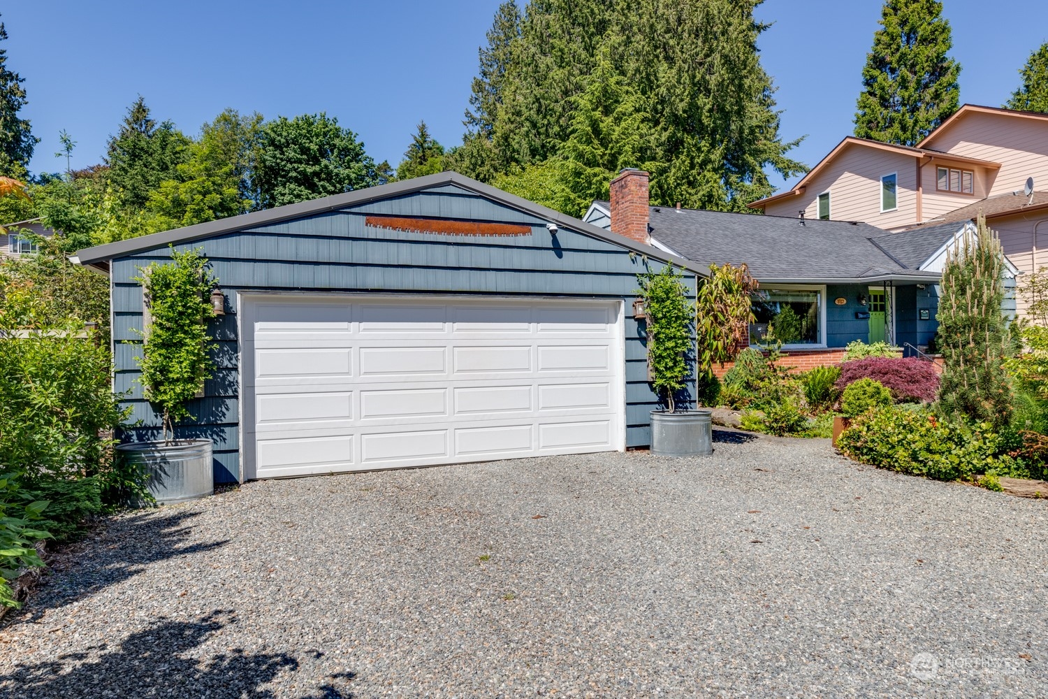 3912 Friday Avenue Everett, WA 98201 - Photo 34 of 35 a front view of a house with a yard and garage