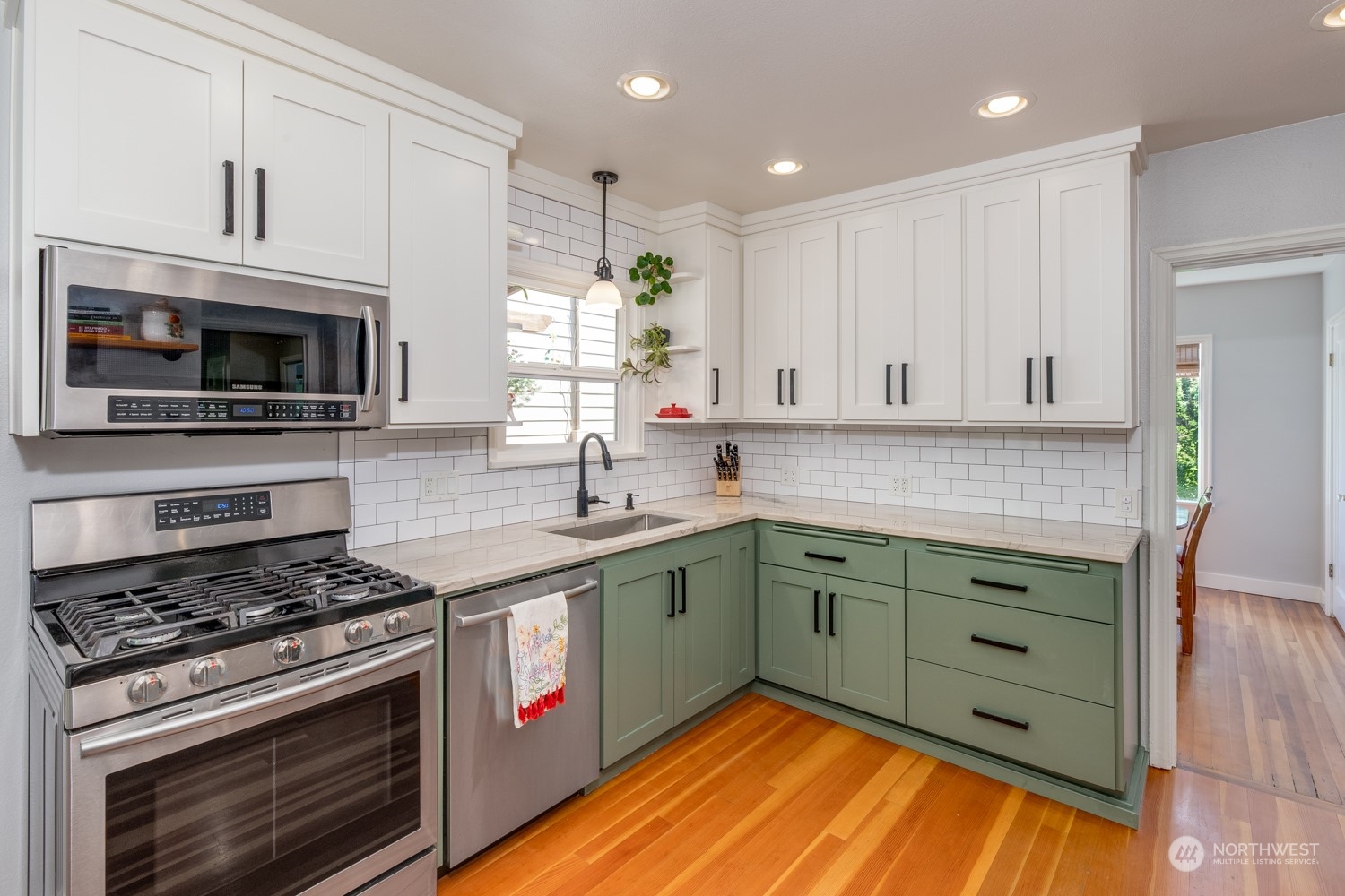 3912 Friday Avenue Everett, WA 98201 - Photo 9 of 35 a kitchen with stainless steel appliances granite countertop a stove and a sink