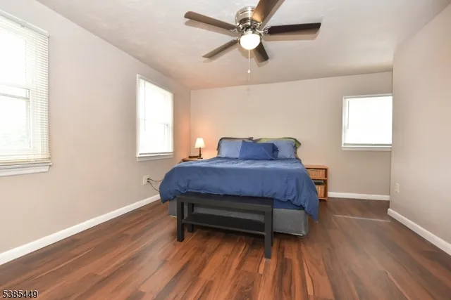 a living room with a bed furniture and a window