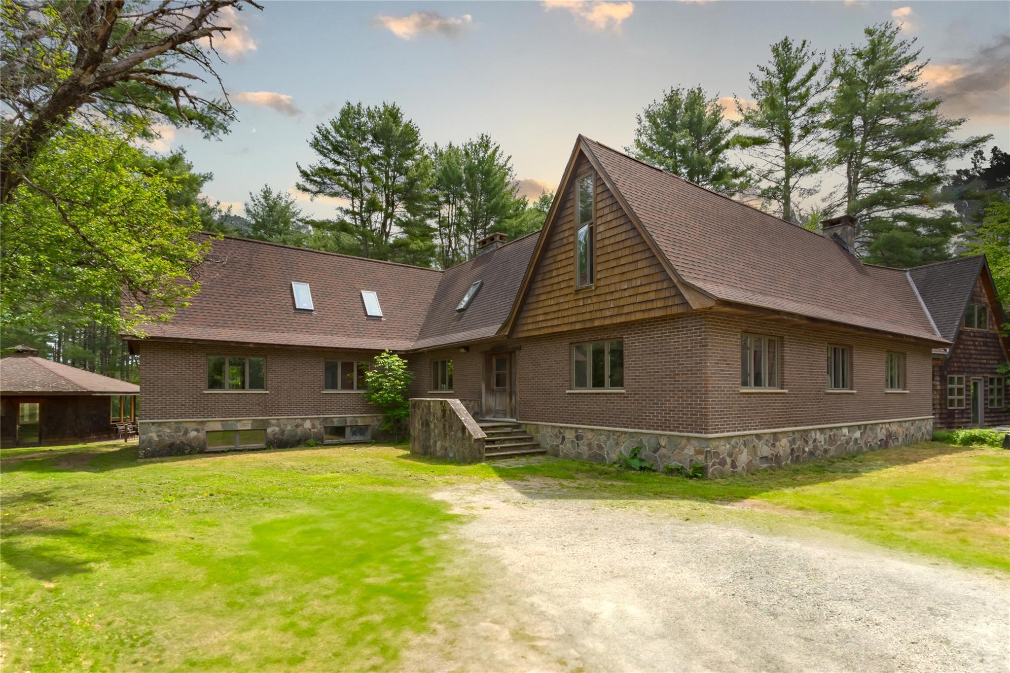 a front view of a house with yard