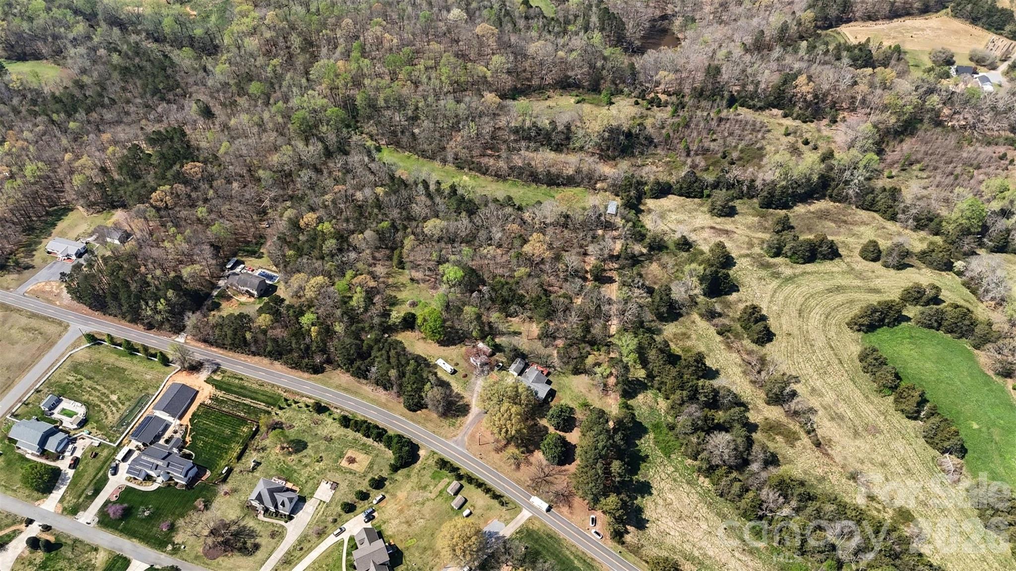 252 Teeter Road Mooresville, NC 28115 - Photo 13 of 22 a view of a yard with a plant
