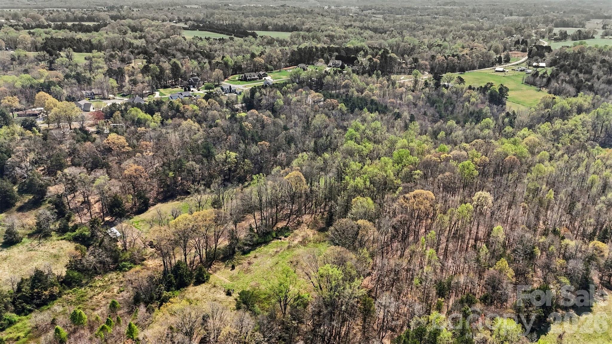 252 Teeter Road Mooresville, NC 28115 - Photo 15 of 22 an aerial view of residential house with green space and fog