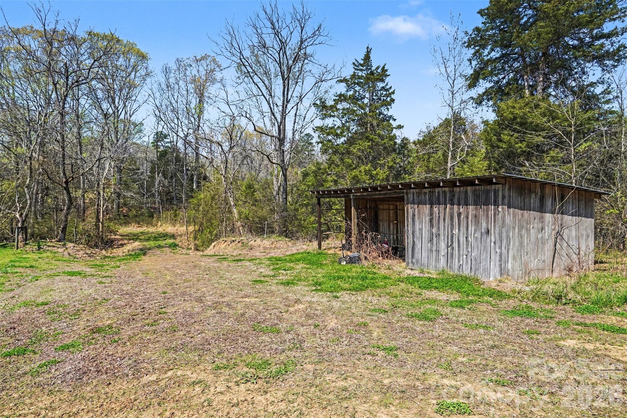 252 Teeter Road Mooresville, NC 28115 - Photo 21 of 22 a backyard of a house with lots of green space