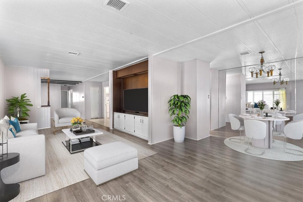 14851 Jeffrey Road, Unit 248 Irvine, CA 92618 - Photo 12 of 27 a living room with furniture and a flat screen tv