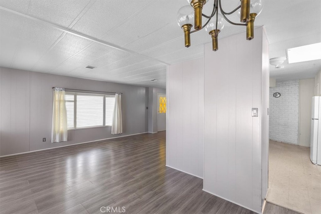 14851 Jeffrey Road, Unit 248 Irvine, CA 92618 - Photo 14 of 27 an empty room with wooden floor and windows