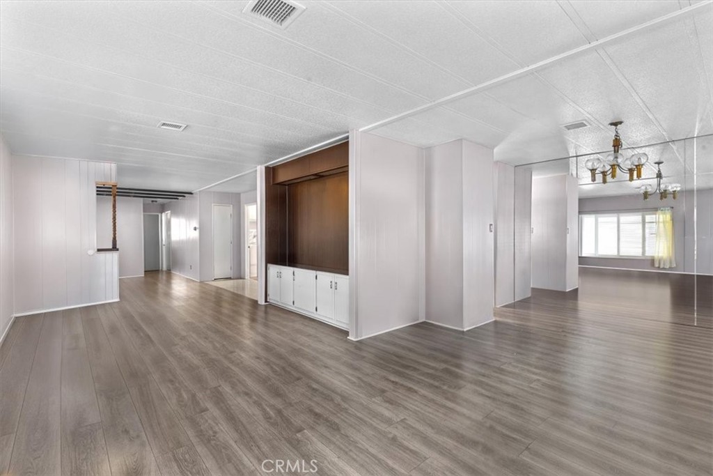 14851 Jeffrey Road, Unit 248 Irvine, CA 92618 - Photo 15 of 27 a view of a big room with wooden floor and windows