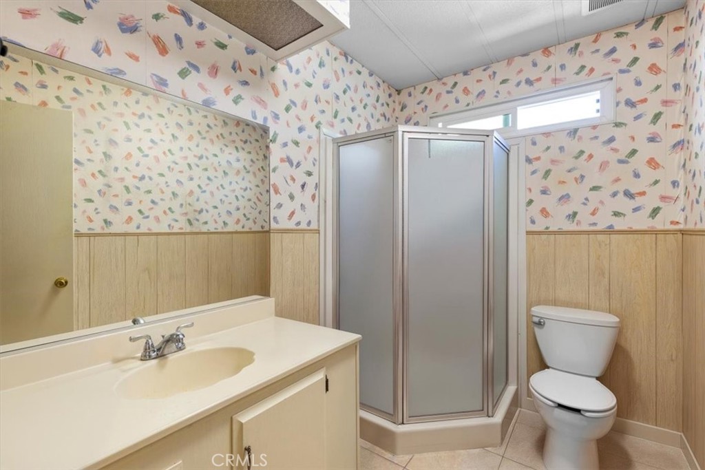 14851 Jeffrey Road, Unit 248 Irvine, CA 92618 - Photo 20 of 27 a bathroom with a sink toilet and shower