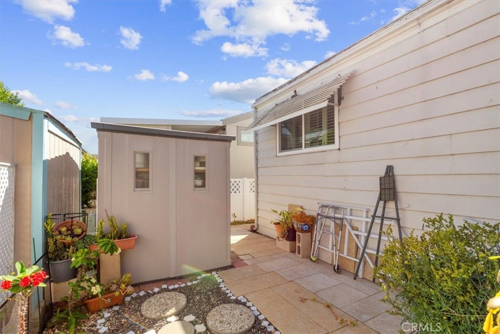 14851 Jeffrey Road, Unit 248 Irvine, CA 92618 - Photo 7 of 27 a view of a porch with chairs and potted plants