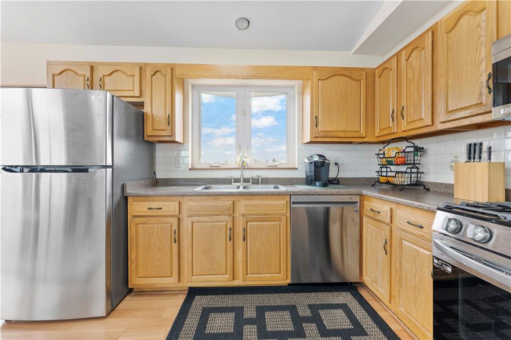 321 Chambers Ridge Road West Alexander, PA 15376 - Photo 14 of 42 a kitchen with stainless steel appliances granite countertop a refrigerator sink and stove
