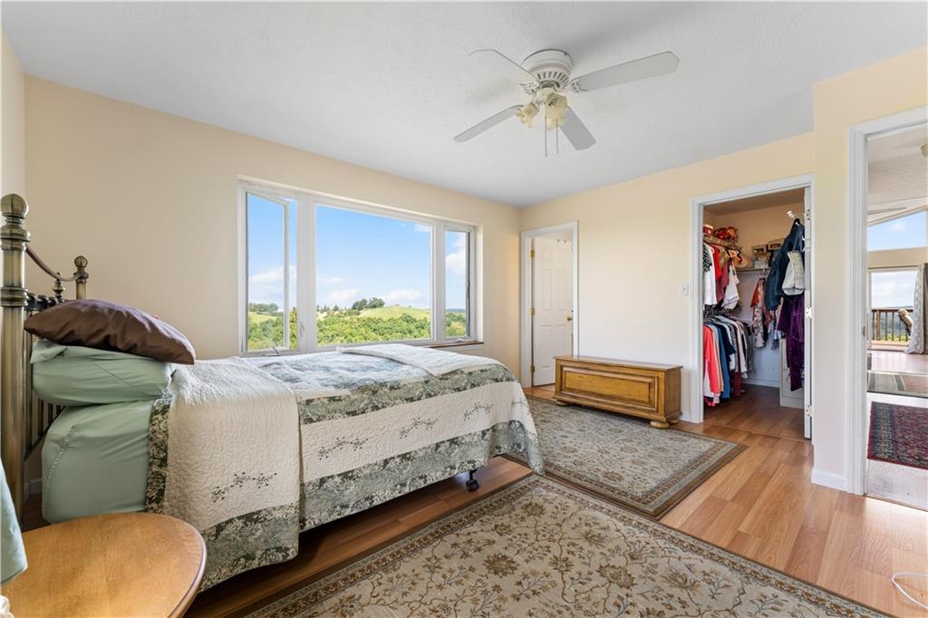 321 Chambers Ridge Road West Alexander, PA 15376 - Photo 17 of 42 a bedroom with a bed and a chandelier